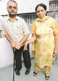 Gurmeet Kaur along with her husband Shingara Singh await Chief Ministers ruling on her transfer.