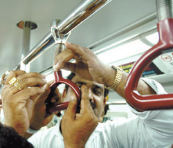 The enthusiasm of taking a ride on the Metro train took its toll as an overhead handrest gave in within the compartment where the VIPs were travelling on the inaugural run on the new section today. 