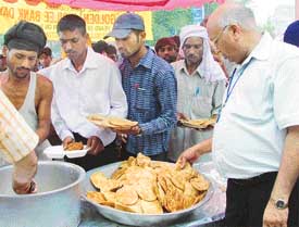 Mr S.K. Jain, Assistant General Manager, SBI, at a langar organised by the bank to celebrate its golden jubilee in Ludhiana on Saturday
