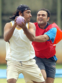 Virender Sehwag and JP Yadav play throwball on the sixth day of the pace bowlers camp at the National Cricket Academy in Bangalore on Saturday
