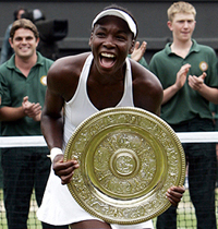 Venus Williams of the US celebrates with the trophy
