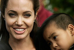 Hollywood actress and United Nations High Commission for Refugees Goodwill Ambassador Angelina Jolie poses with her son