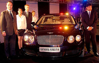 Models at the launch of the new Bentley Continental Flying Spur car, the fastest four-door vehicle in the world with a top speed of 312 kmph, in New Delhi on Sunday