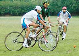 Mandeep Singh Mann of India hits the ball during a cycle polo match against Pakistan in Sector 17, Chandigarh
