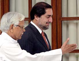 External Affairs Minister Natwar Singh gestures to Afghanistans Foreign Minister Abdullah Abdullah before their meeting in New Delhi on Sunday.