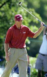 Jim Furyk gestures after sinking an eagle putt on the 15th hole during the third round of the Western Open in Lemont, Illinois, on Sunday