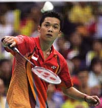 Indonesias Taufik Hidayat returns a shot to Chinas Chen Hong during their mens singles final at the Singapore Open badminton championship on Sunday