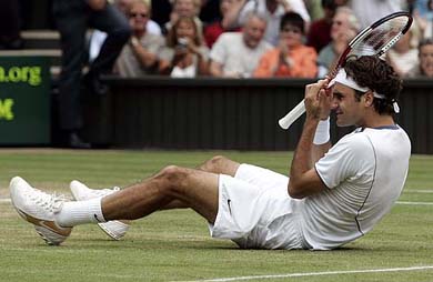 Switzerlands Roger Federer celebrates on winning the mens final against Andy Roddick of the USA at the Wimbledon tennis championships in London on Sunday