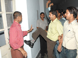 Activists of Ambedkar Student's Organisation go on a rampage outside the office of the Principal, Sri Ram College of Commerce, against alleged irregularities in admitting SC/ST students to the college