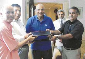 Caparo Group Chairman Lord Swraj Paul with Vice-Chancellor of Punjab Technical University S.K.Salwan (second from left), after signing an MoU in New Delhi on Monday for the establishment of a school of manufacturing and material technology in Jalandhar. 