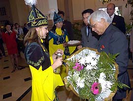 External Affairs Minister K. Natwar Singh is accorded a traditional welcome by girls at Astana airport in Kazakhstan on Monday