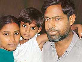 Raj Kumar with his wife and child