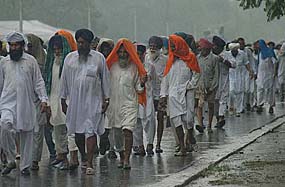 Workers of the Shiromani Akali Dal arrive to attend a rally in Chandigarh on Tuesday against the hike in petrol and diesel prices and the power tariff.
