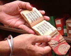 A view of miniature manuscript preserved in Sikh History Research Department.