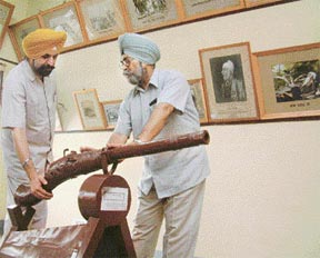 Dr Daljit Singh (left) and Dr K.S. Bajwa take stock of the damage done to cannon dating back to the medieval period of the Sikh history.