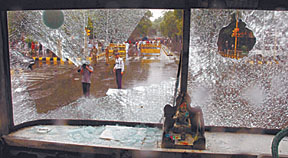 The damaged front glass of a Blue Line bus, broken by the Bajrang Dal activists during their protest against Ayodhya attack
