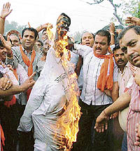 Activists belonging to various RSS affiliated organisations burn an effigy of terrorism outside the Mini Secretariat in Ludhiana on Wednesday. 