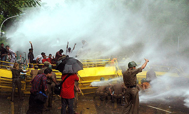 Delhi policemen use water cannon to disperse protesting BJP, VHP and Bajrang Dal members during a demonstration on Wednesday. 