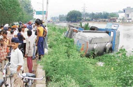 A milk van that fell in the Sidhwan canal near Gill road bridge in Ludhiana