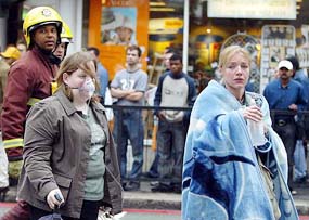 Injured tube passengers are escorted away from Edgware Road Tube Station in London following an explosion on Thursday.