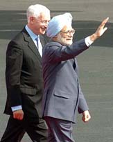 Prime Minister Manmohan Singh waves to the kids who were waiting to accord him a warm welcome upon his arrival at the Prestwick airport on Thursday.