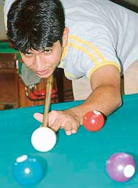 Sameer Bhalla aims to pot the ball in Ch Vishnu Pal Singh Memorial 9-ball Pool Tournament at the Chandigarh Billiards and Coaching Centre, Sector 22, Chandigarh, on Friday. 