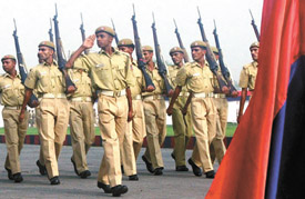 Passing-out constables salute the Commissioner of Police Dr KK Paul during a parade at Delhi Police Training College at Jharoda Kalan in the Capital on Friday