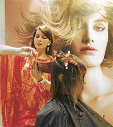 Sandra Bery, a Germany-based hairstylist, in a saloon at Sarabha Nagar, Ludhiana, on Friday
