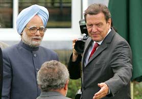 Germanys Chancellor Gerhard Schroder calls Brazils President Luiz Inacio da Silva, into a photo opportunity with Indias Prime Minister, Dr Manmohan Singh, during the G8 Summit in Gleneagles, Scotland.