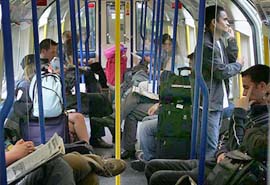 Passengers travel on the London underground on Friday, a day after four explosions were detonated on public transport in London.