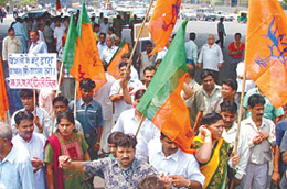 BJP activists demonstrating against the hike in power tariff near Defence Colony bridge in the Capital on Saturday.