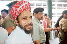 Baba Piara Singh Bhaniarawala leaves a local court under tight security in Ambala on Saturday