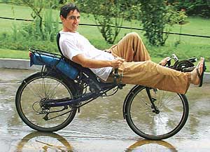 Frenchman Christopher Huggina pedals through the rain in Chandigarh on Sunday.
