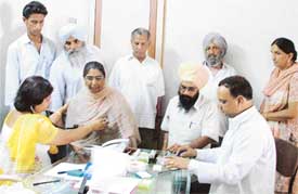 Doctors examine patients at a free medical camp organised in Ludhiana