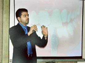 A technique of tooth-whitening being explained at a press conference in Ludhiana on Sunday