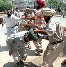 A scuffle between the police and teachers during the teachers demonstration in Amritsar on Sunday.