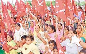 Members of the FCI Mazdoor Federation organise a rally in Chandigarh