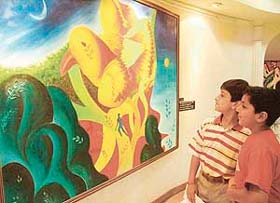 Kids have a close look at a painting at an exhibition at Indus Ind Art Gallery in Chandigarh