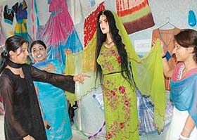 A student of National Polytechnic displays her designs during the annual exhibition at Panchkula