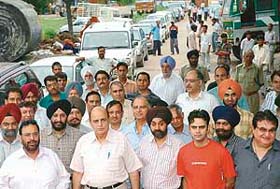 Members of the Industrial Associations and plot owners take out a rally against conversion rates announced by the UT Administration for plots in Industrial area in Chandigarh