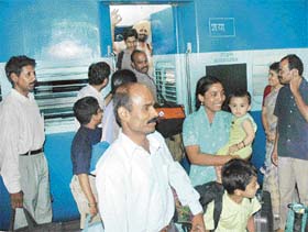 Jubilant passengers get down from the Kerala Sampark Kranti Express at the Chandigarh Railway Station
