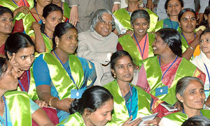 President A P J Abdul Kalam posing for a group photo with 'Jamsetji Tata National Virtual Academy for Rural Prosperity' fellows in New Delhi on Monday