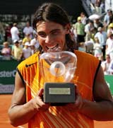 Rafael Nadal of Spain holds the trophy after winning the final against Tomas Berdych of the Czech Republic at the Swedish Open tennis tournament in Bastad, Sweden