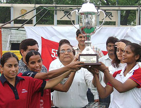 Sumrai Tete of Railways and Simarjeet and Sandeep Kaur of Haryana receive the trophy for the 53rd Senior Womens National Hockey Championship at Shivaji Stadium in New Delhi on Monday