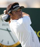 Japans Shigeki Maruyama watches the ball after teeing off on the second day of practice for the British Open at St Andrews