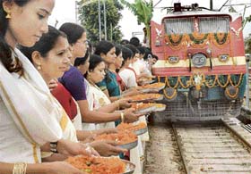 Attired in traditional dress, members of the Kerala Samajam perform a ritual at the flagging-off ceremony of the Kerala Sampark Kranti Express train at the Chandigarh Railway Station