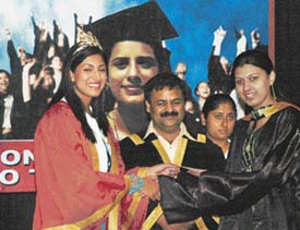 Ms Sindura Gadde along with NIFD Centre Director Arvind Gupta award degrees to students during the annual convocation of the NIFD in Ludhiana on Wednesday. 