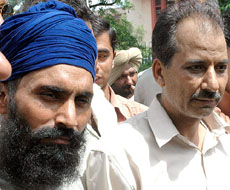 Dilbagh Singh, militant of Babbar Khalsa, and Surender Singh, travel agent, arrested by the Crime Branch of the Delhi Police, in New Delhi on Friday.