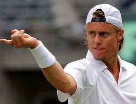 Australias Lleyton Hewitt gestures towards his opponent, Argentinas Guillermo Coria, during their Davis Cup quarterfinal match in Sydney on Friday