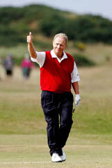 Jack Nicklaus acknowledges the applause as he walks up the 17th fairway on the second day of the British Open in St Andrews on Friday. 